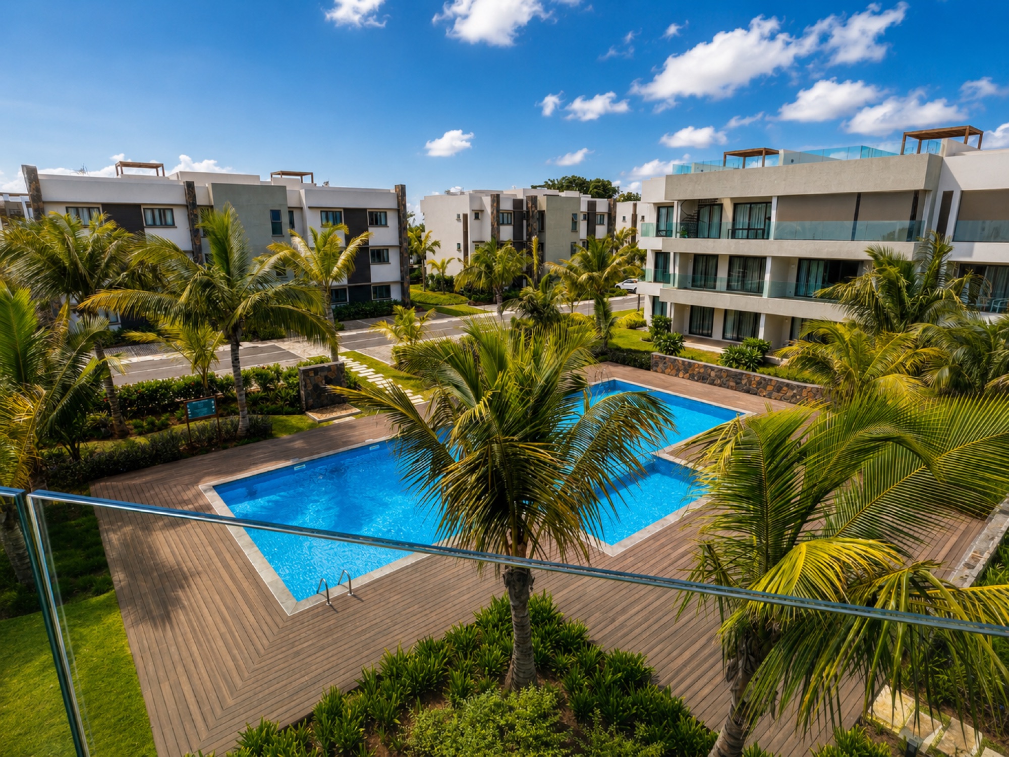 Three-bedroom penthouse balcony overlooking the pool and gardens
